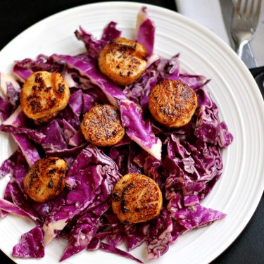 Spicy Pan Seared Scallops over a Red Cabbage Citrus Slaw