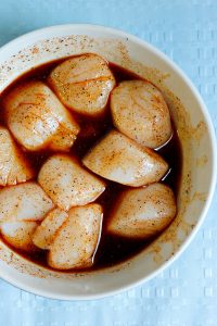 Spicy Pan Seared Scallops over a Red Cabbage Citrus Slaw